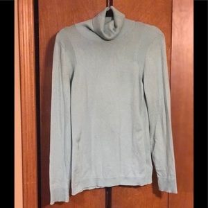 Soft green turtleneck sweater.